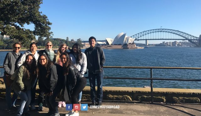 Photograph of a group of University of Hawaii at Manoa Faculty-Sponsored Study Tours students in Sydney, Australia, with the Sydney Opera House in the background.