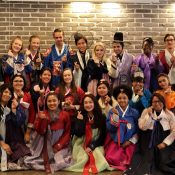Study Abroad students at Dankook University dressed in hanbok and posing for a group picture.